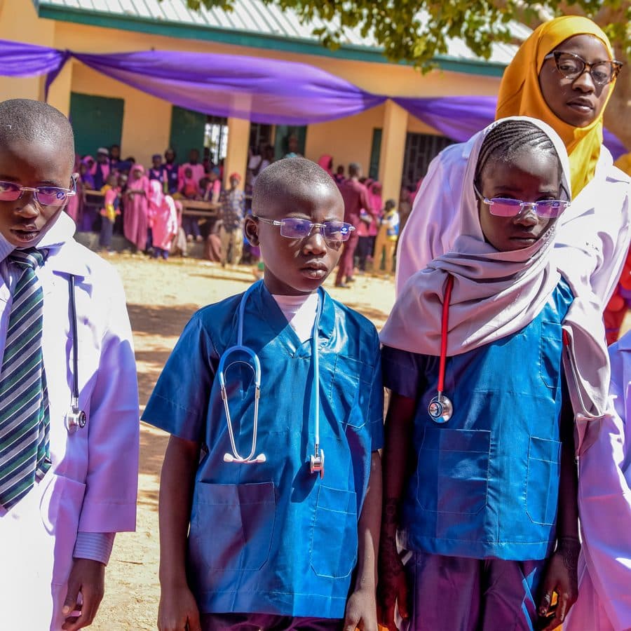 Pupils dressed as doctors and nurses lined up on Career Day